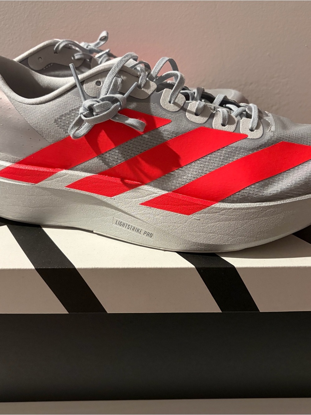 adidas Men’s Adjzero Evo SL M Running Shoe - Gray with Bright Red Stripes